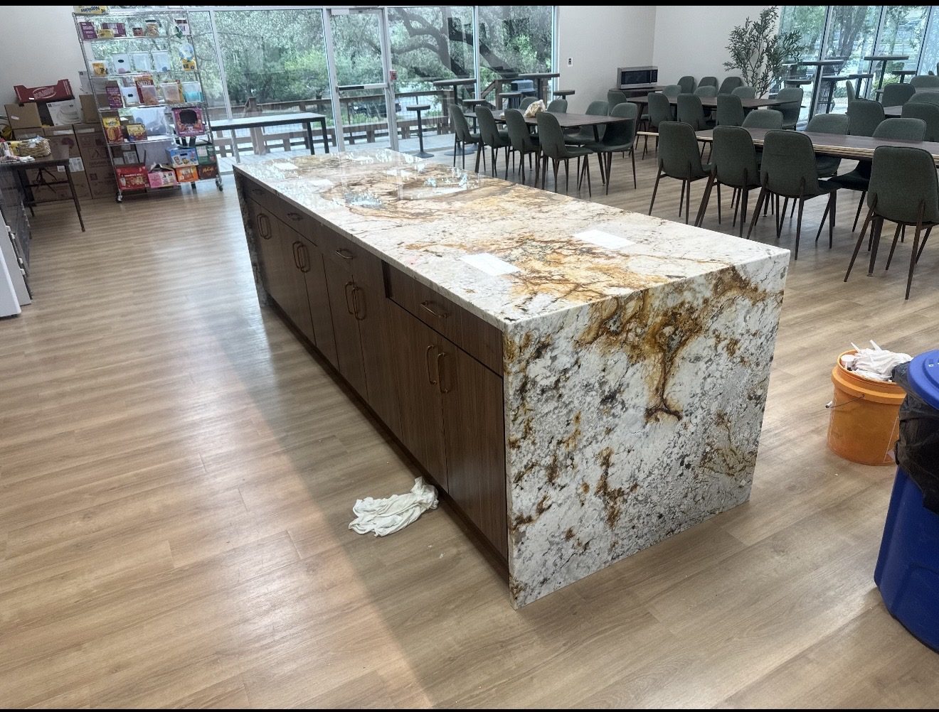 White and gold granite waterfall island installed in a commercial cafeteria, San Antonio TX