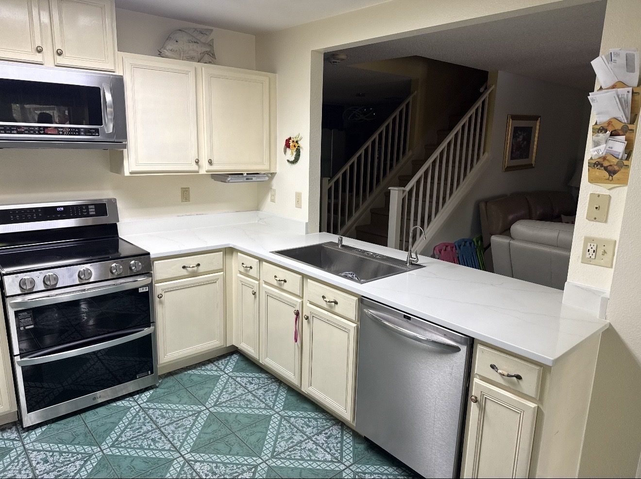 White quartz kitchen countertops with cream cabinets and undermount sink, San Antonio TX