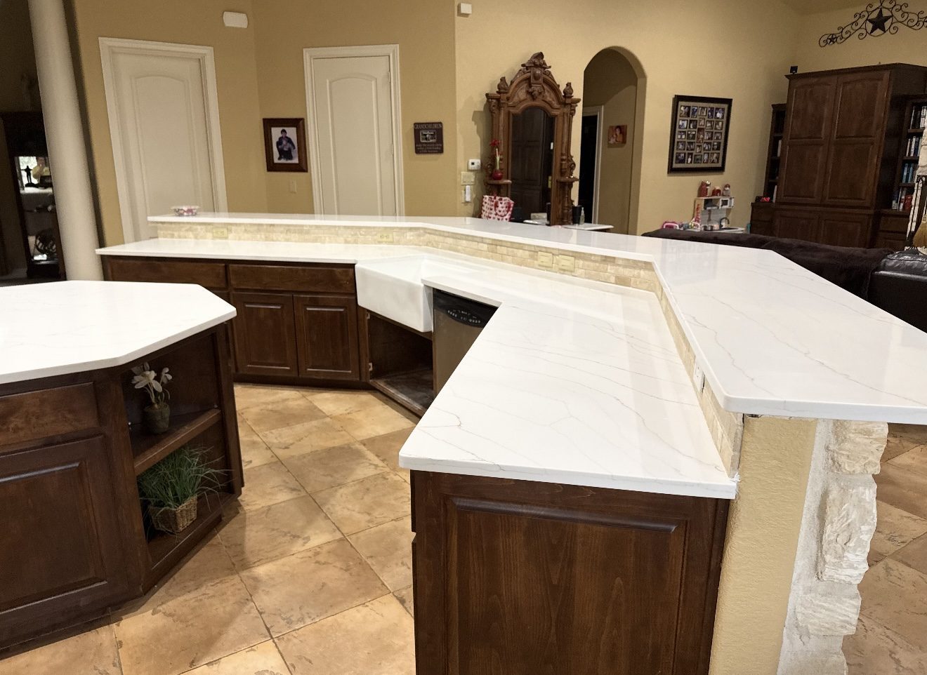 White quartz wraparound kitchen peninsula on dark cabinets, San Antonio TX